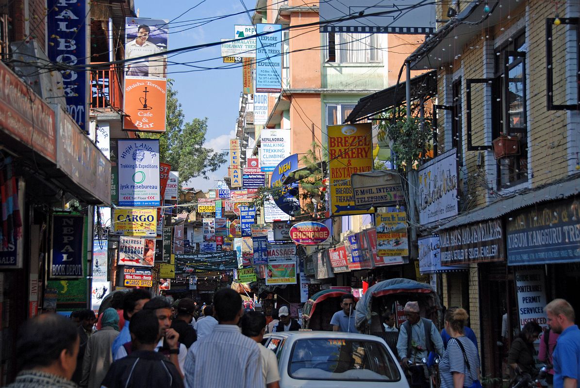 Kathmandu 02 01 Thamel Busy Street After I arrive in Kathmandu, I head to the busy streets of Thamel. Thamel has many book shops, souvenir shops, trekking gear shops, trekking agencies, low and medium-priced hotels, and restaurants. Thamel is busy both day and night.